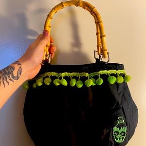 Sour puss shrunken head purse